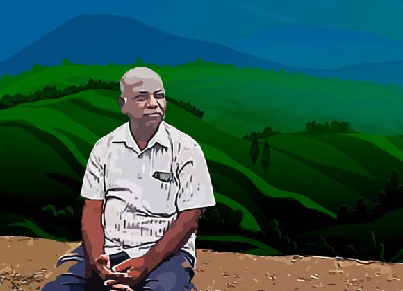 a person sitting on a road side pillar with hills and sky in the background