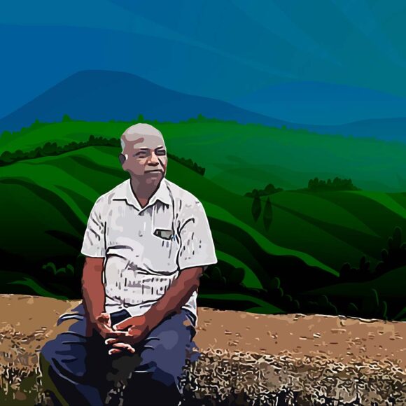 a person sitting on a road side pillar with hills and sky in the background